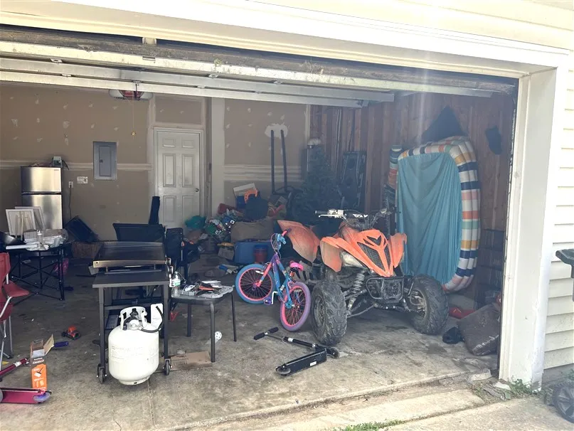 Garage filled with household items before an A-Z cleanout