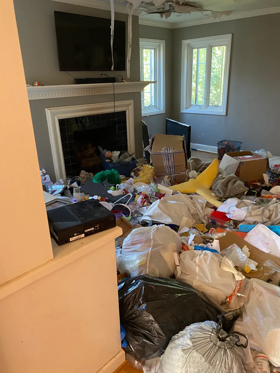 Rental property room with items awaiting cleanout